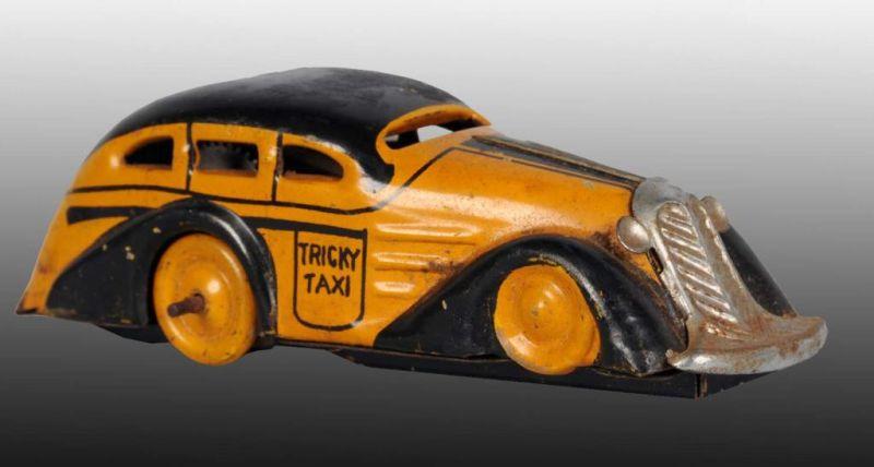 Appraisal: Tin Marx Tricky Taxi Wind-Up Toy Description American Working Marked