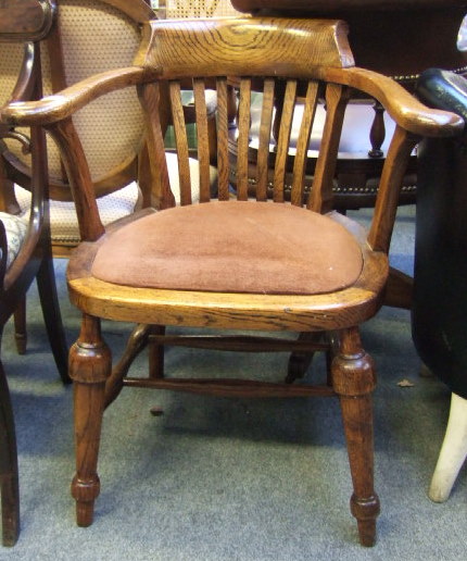 Appraisal: A th century oak tub chair with open arms and