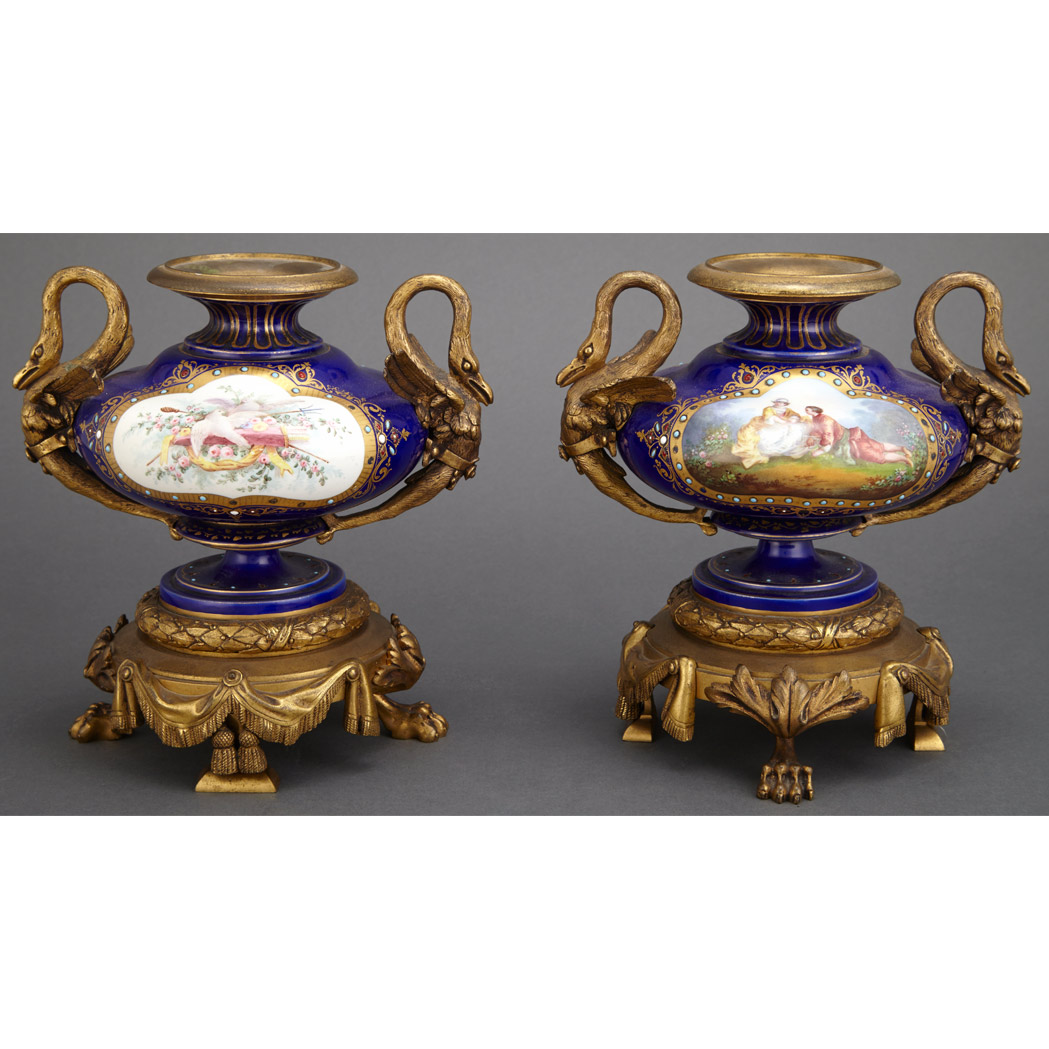 Appraisal: Pair of Sevres Style Porcelain and Gilt-Bronze Urns First quarter