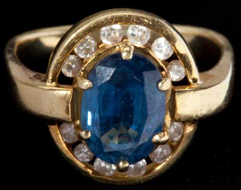 Appraisal: Sapphire and Diamond Ringcentering on one oval shaped sapphire x