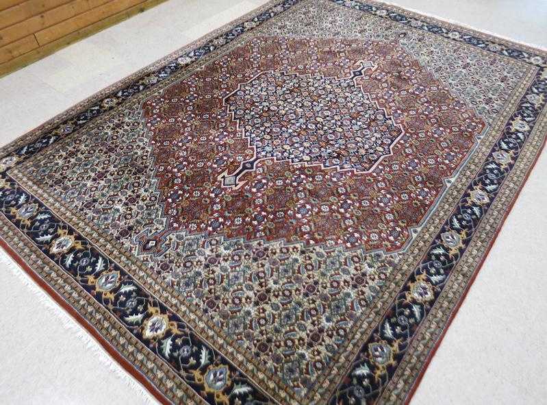 Appraisal: HAND KNOTTED ORIENTAL CARPET Indo-Persian featuring an overall Herati floral