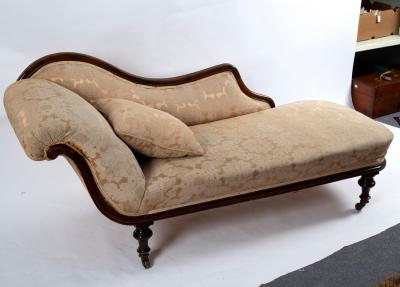 Appraisal: A Victorian upholstered scroll end settee with walnut show wood