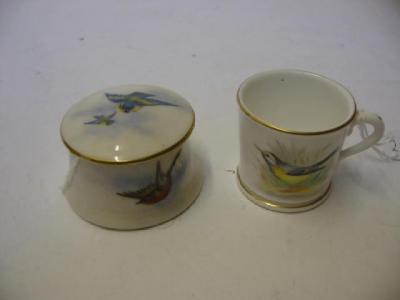 Appraisal: A ROYAL WORCESTER PORCELAIN MINIATURE MUG painted with a bird