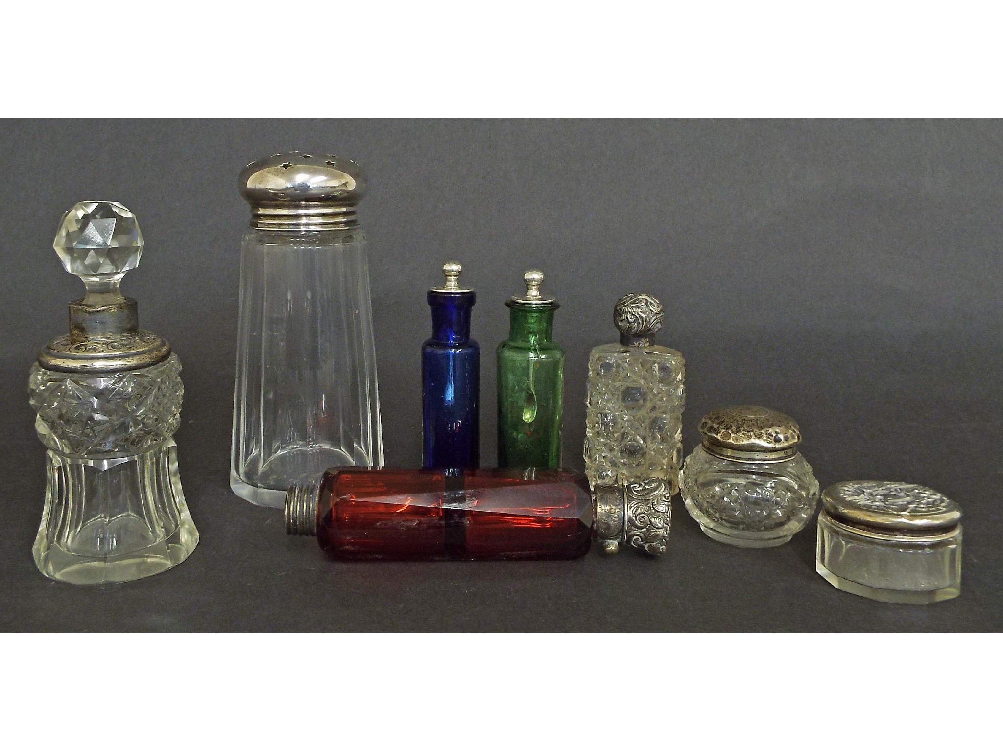 Appraisal: Collection of silver and glass bottles to include two coloured