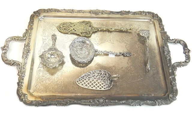 Appraisal: A Dutch serving slice with cast and pierced decoration a