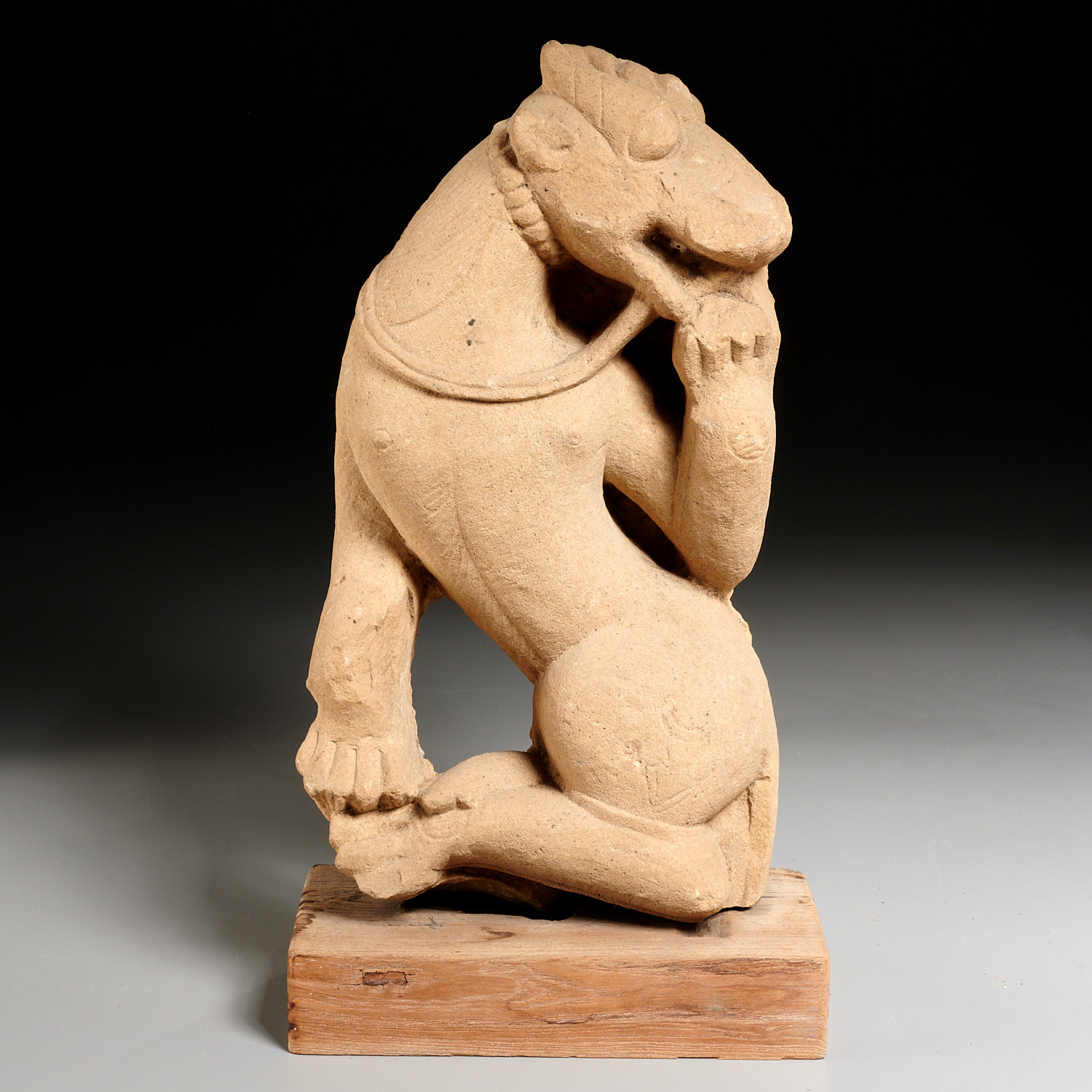 Appraisal: EARLY ASIATIC SANDSTONE ANIMAL CARVING th- th c harnessed goat