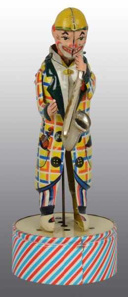 Appraisal: Tin Litho Clown Saxophone Player Wind-Up Toy Description German Working