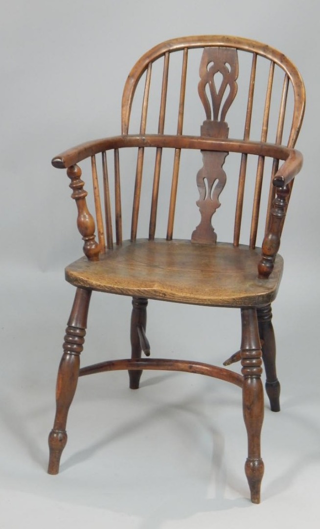 Appraisal: A mid thC yew ash and elm Windsor chair with