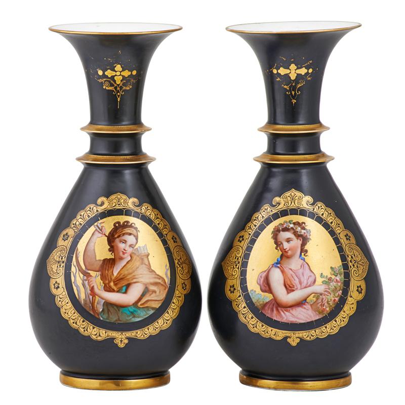 Appraisal: PAIR OF PARIS PORCELAIN VASES Hand-painted reserves on ebonized ground