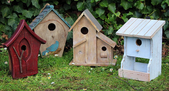 Appraisal: A GROUP OF FOUR WOODEN BIRD HOUSES OR BOXES the