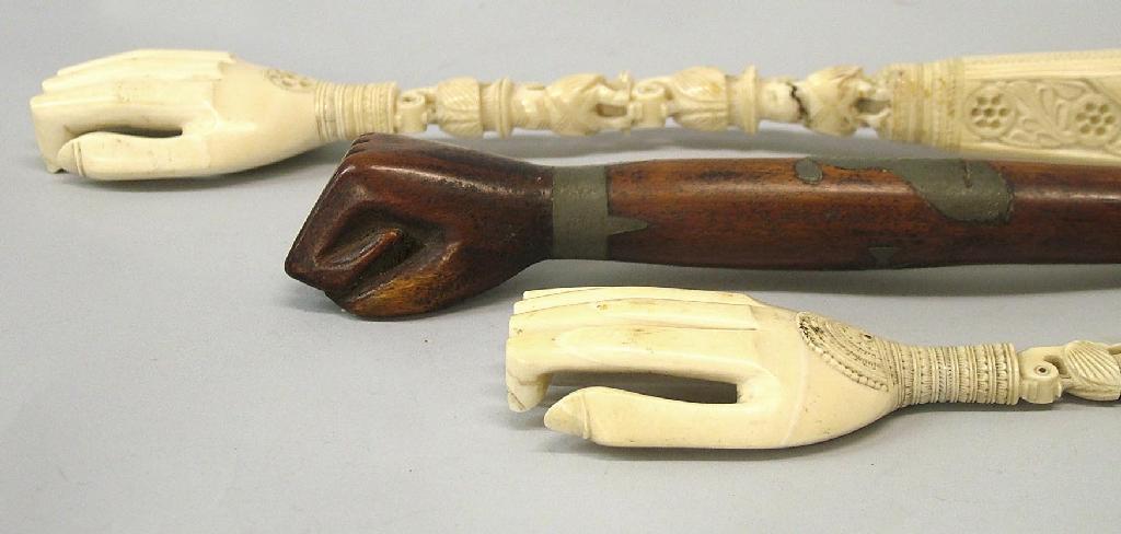 Appraisal: th century Oriental ivory back scratcher in the form of