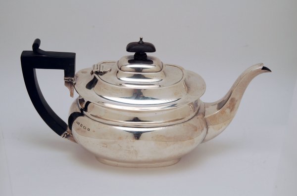 Appraisal: English sterling silver teapot oval in shape with stepped rim