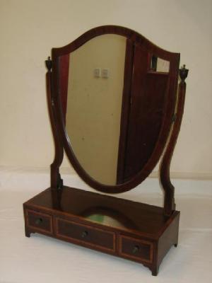 Appraisal: AN EDWARDIAN MAHOGANY TOILET MIRROR of oblong form crossbanded with