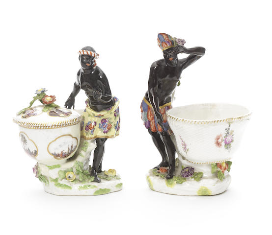 Appraisal: A pair of Meissen blackamoors with boxes and one cover