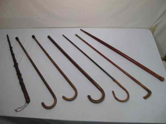 Appraisal: Group lot of seven assorted wooden canes Condition signs of