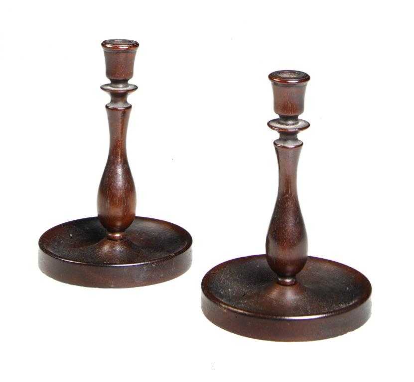 Appraisal: A PAIR OF GEORGE III TURNED MAHOGANY TOY CANDLESTICKS the