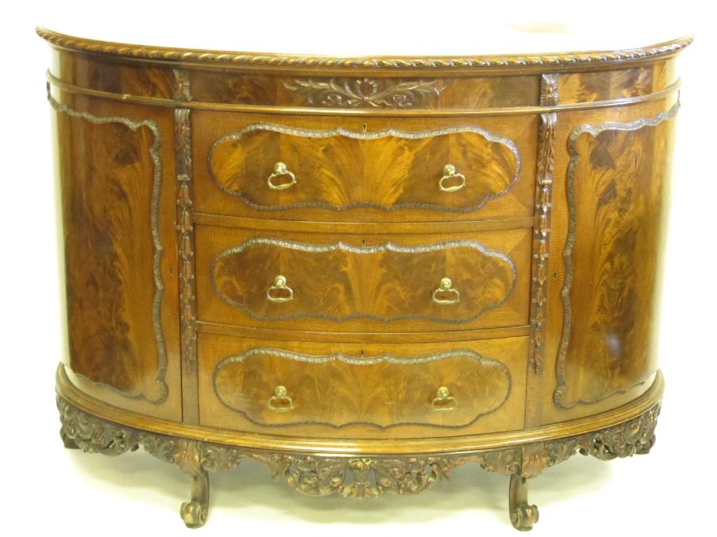 Appraisal: A Chippendale style mahogany demi-lune Commode with gadroon edge above