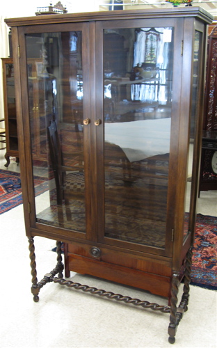 Appraisal: DARK MAHOGANY CHINA CABINET American c 's having three interior