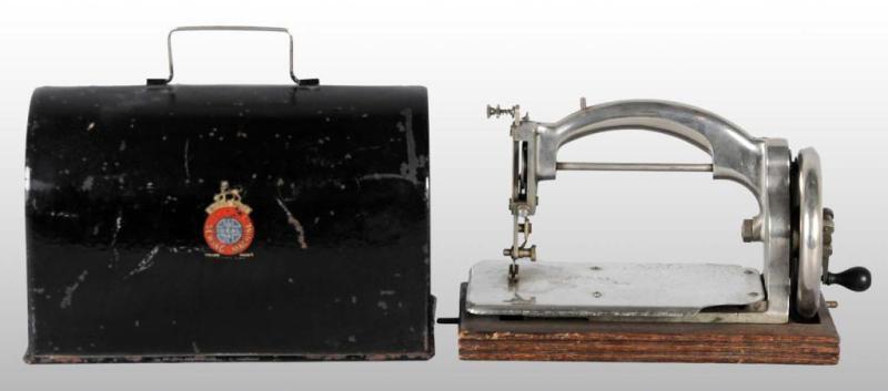 Appraisal: Ideal Silver Sewing Machine Description With metal cover Working Condition