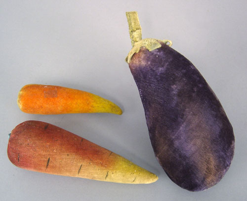 Appraisal: Velvet eggplant pincushion l together with carrots l and l