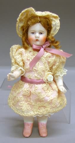 Appraisal: doll with wire strung arms Molded painted features brown mohair