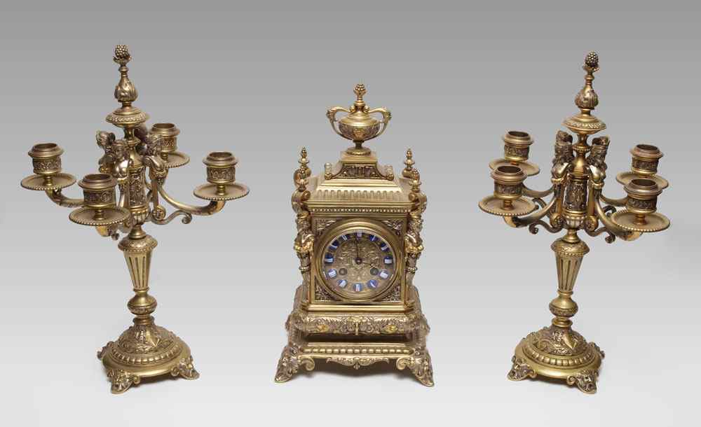 Appraisal: ORNATE FIGURAL GILT BRONZE FRENCH CLOCK GARNITURE SET Stunning and