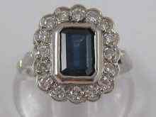 Appraisal: A white metal tests carat gold sapphire and diamond ring