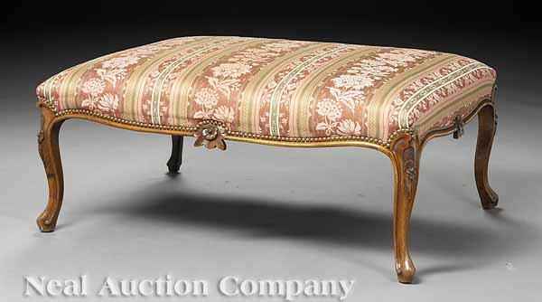 Appraisal: A Large Louis XV-Style Carved Walnut Bench the upholstered seat