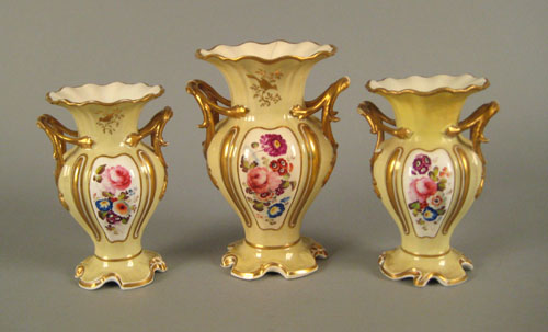 Appraisal: Three Vieux Paris pale yellow and gold porcelain mantle urns