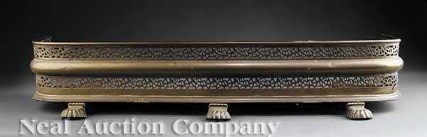 Appraisal: An Antique Pierced Brass Fire Fender in the Regency Taste