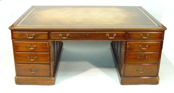 Appraisal: Mahogany Partners desk with a tooled brown leather insert and