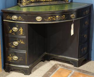 Appraisal: Georgian Chinoiserie style ebonized quarter-round double-pedestal desk having an embossed