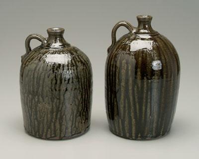 Appraisal: Two Harold Hewell jugs Gillsville Georgia born stoneware with runny