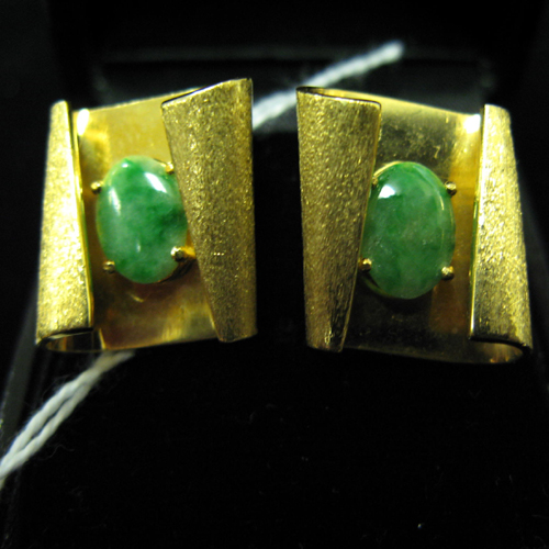 Appraisal: A PAIR OF JADE AND FOURTEEN KARAT GOLD EAR CLIPS