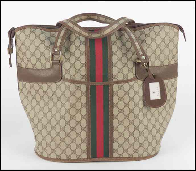 Appraisal: GUCCI MONOGRAMMED CANVAS AND LEATHER TOTE BAG With luggage tag