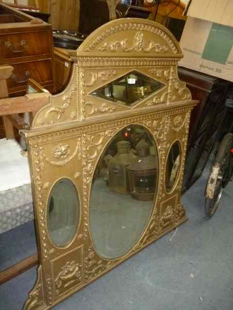 Appraisal: A TH CENTURY GILT OVERMANTLE MIRROR the shaped frame covered