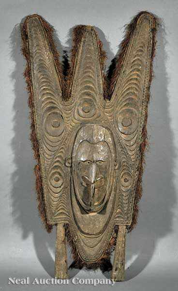 Appraisal: A Papua New Guinea Tanbanum Carved Wood Canoe Prow Splash