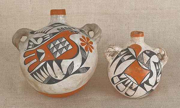 Appraisal: Two Acoma pottery canteens with bird decoration h and h