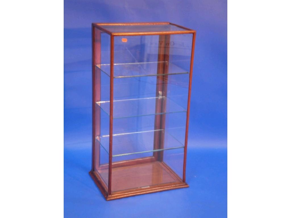 Appraisal: An early thC mahogany shop display cabinet with three glass