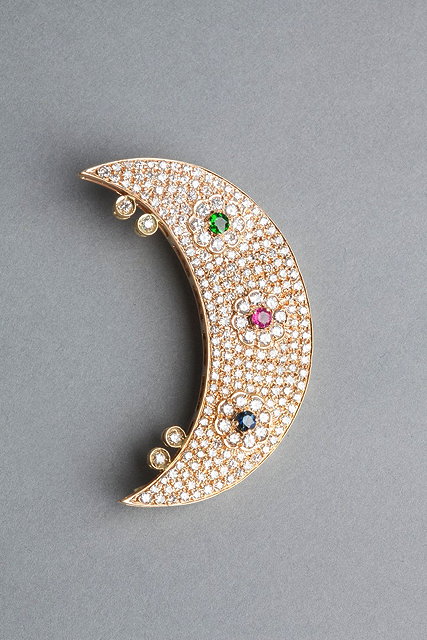 Appraisal: A CONTEMPORARY CRESCENT MOON BROOCH multi set with diamond and