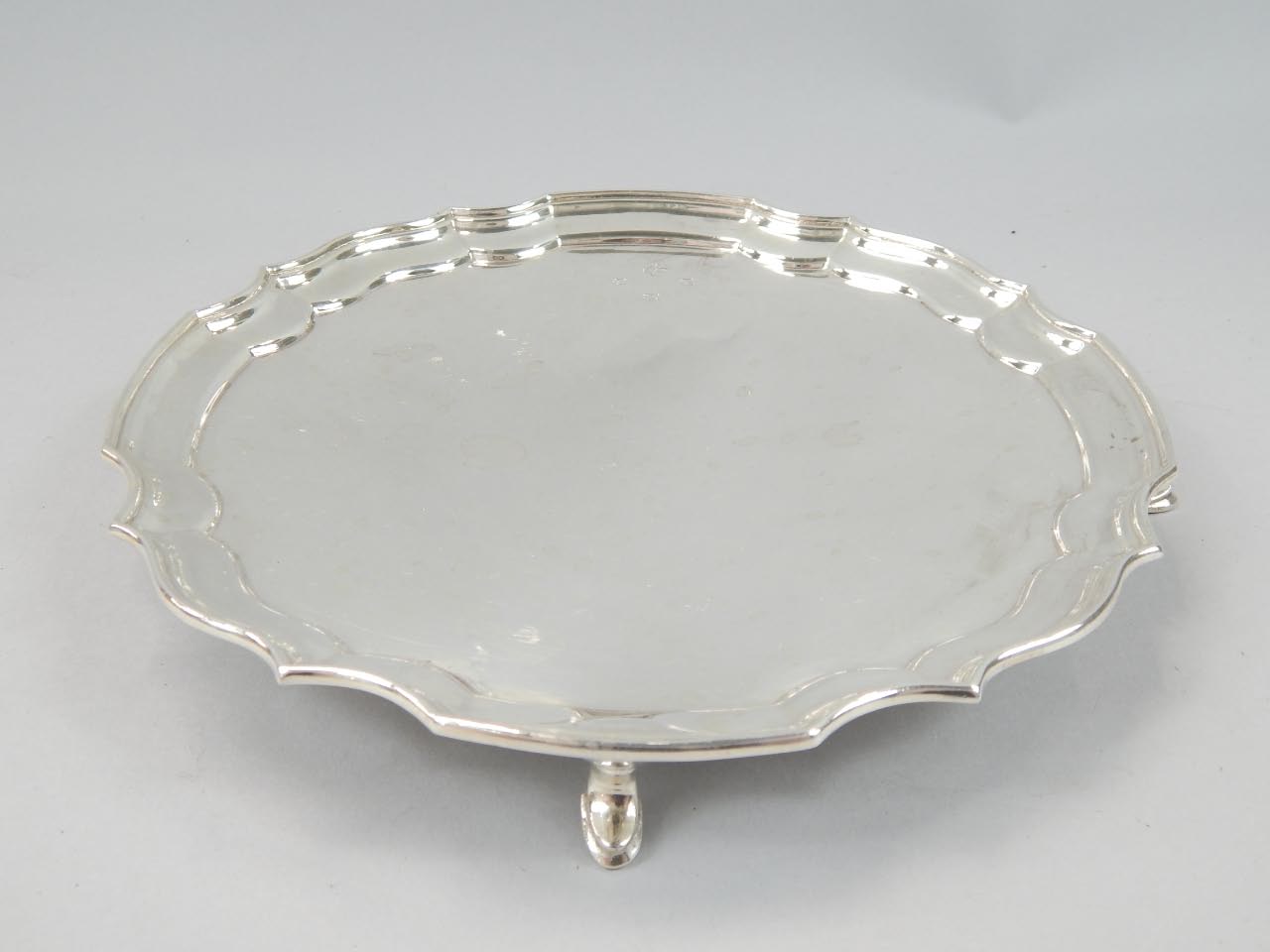 Appraisal: An Elizabeth II silver waiter of scalloped circular outline raised