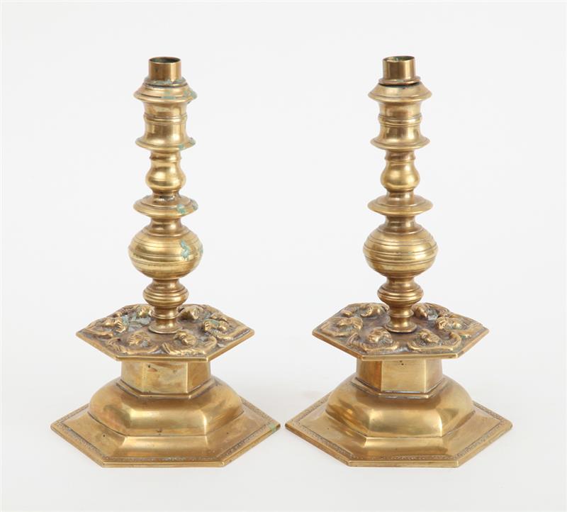 Appraisal: PAIR OF CONTINENTAL BAROQUE BRASS CANDLESTICKS Each tiered stem with