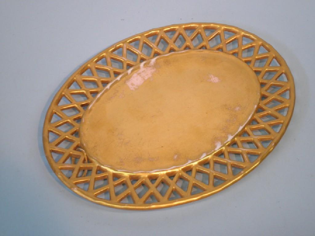 Appraisal: An early thC Derby oval stand with a gold glaze