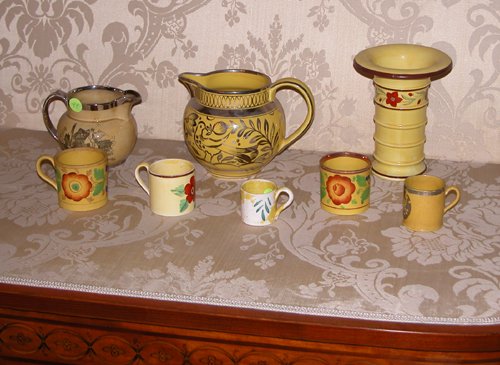 Appraisal: Title Yellow Ware Ceramics mugs one silver resist with age