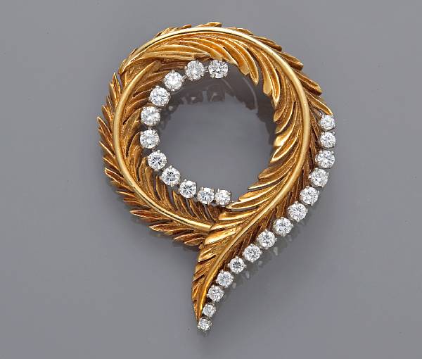 Appraisal: A diamond circle brooch in a leaf motif McTiegue amp