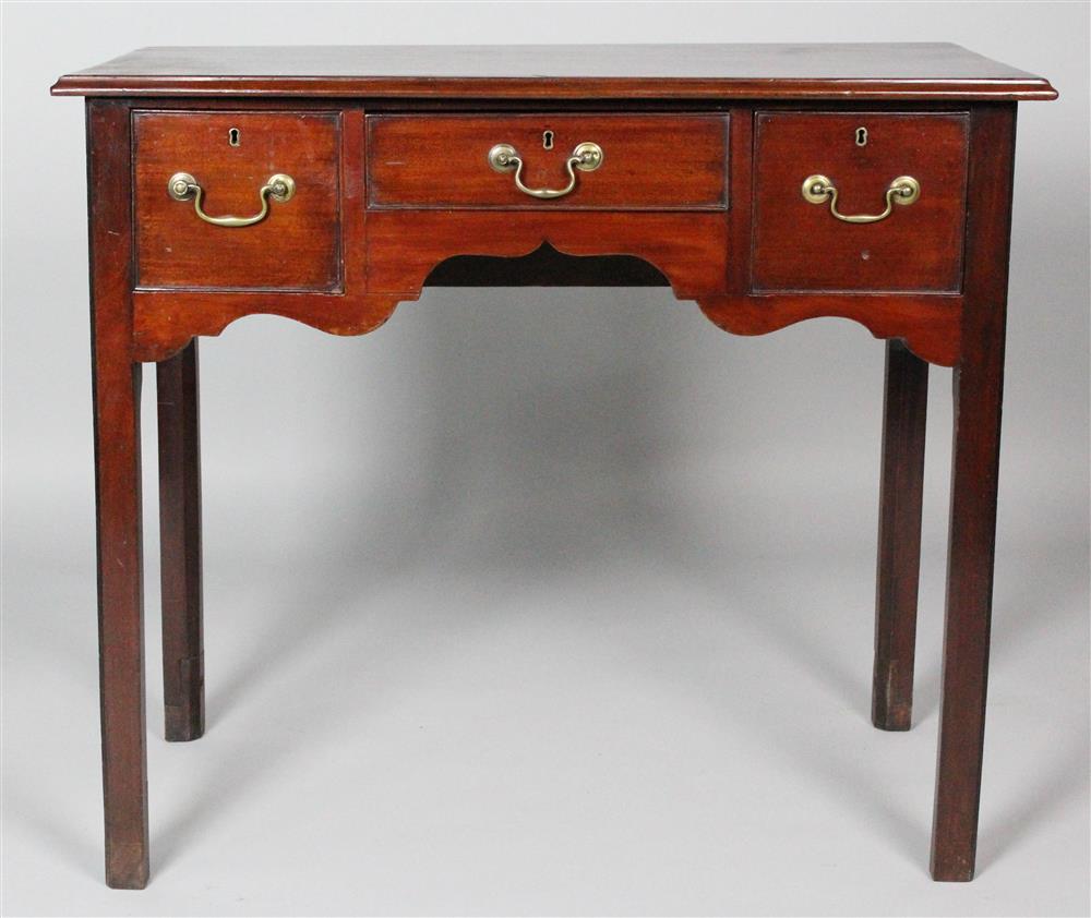 Appraisal: GEORGIAN MAHOGANY LOWBOY having a rectangular top with molded edges