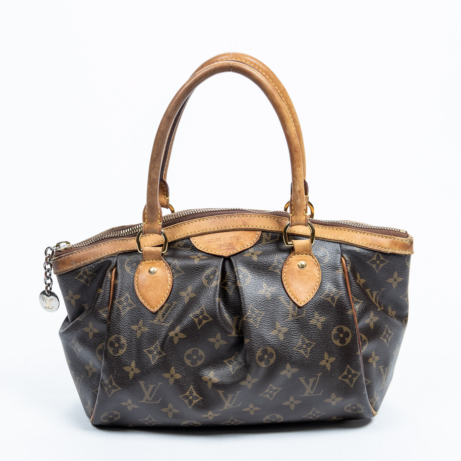 Appraisal: A LOUIS VUITTON MONOGRAM TIVOLI PM A brown and tan