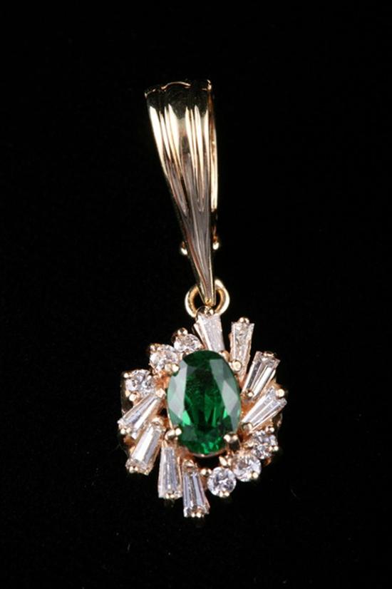 Appraisal: K YELLOW GOLD SYNTHETIC EMERALD AND DIAMOND PENDANT Oval ct