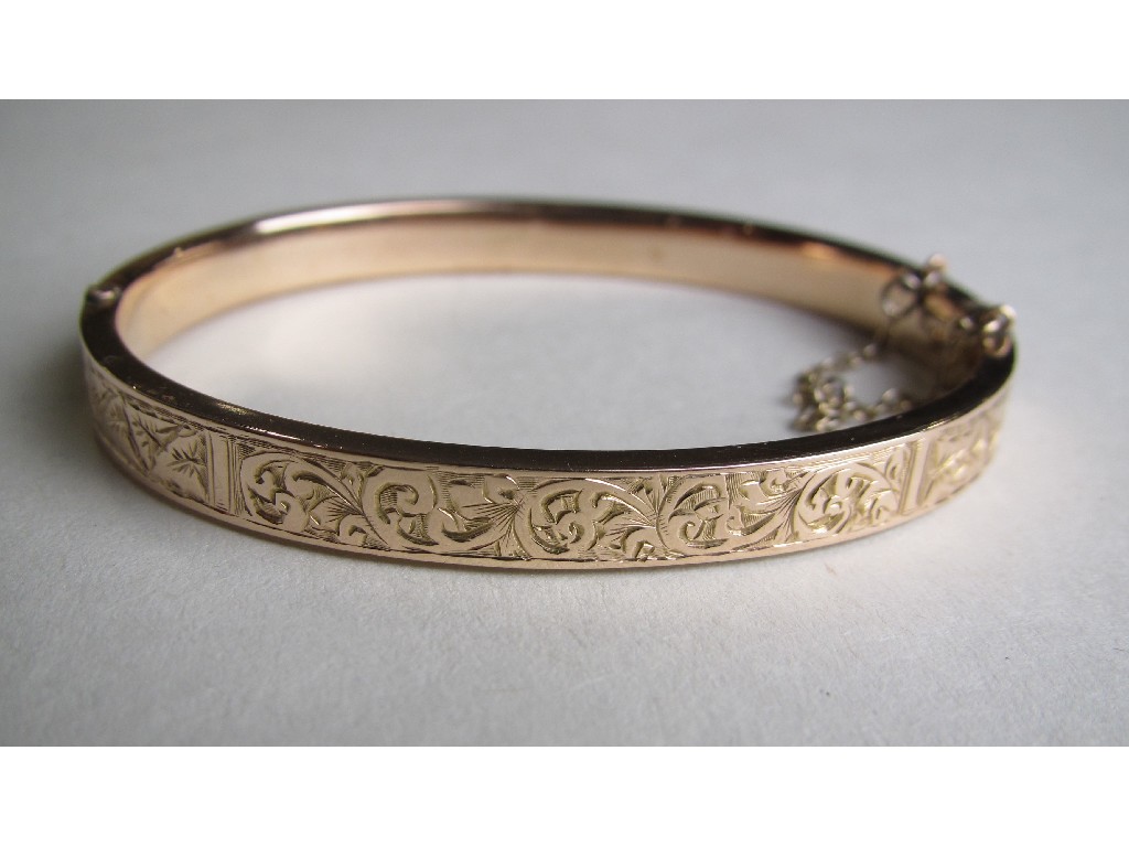 Appraisal: Nine carat rose gold engraved bangle in original box