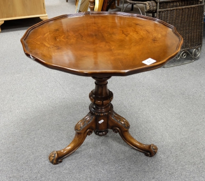 Appraisal: Occasional table with pie crust trim and highly decorated footed